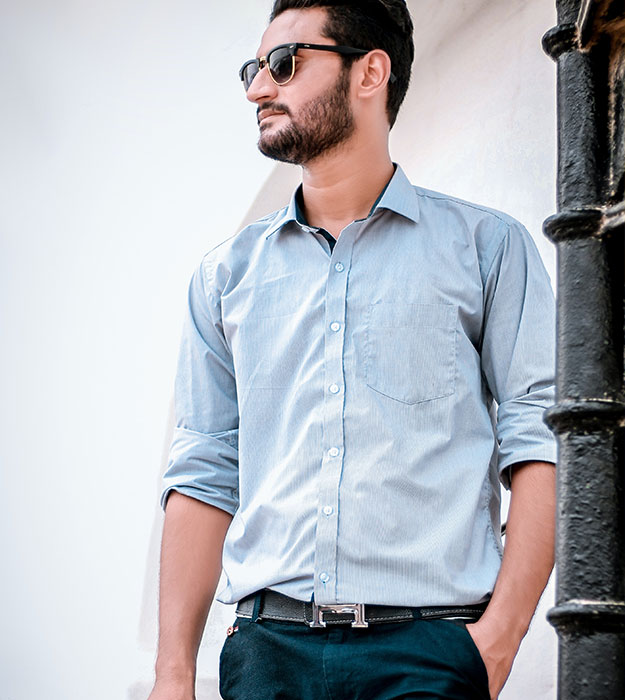 Man wearing pale blue shirt Man wearing pale blue shirt
